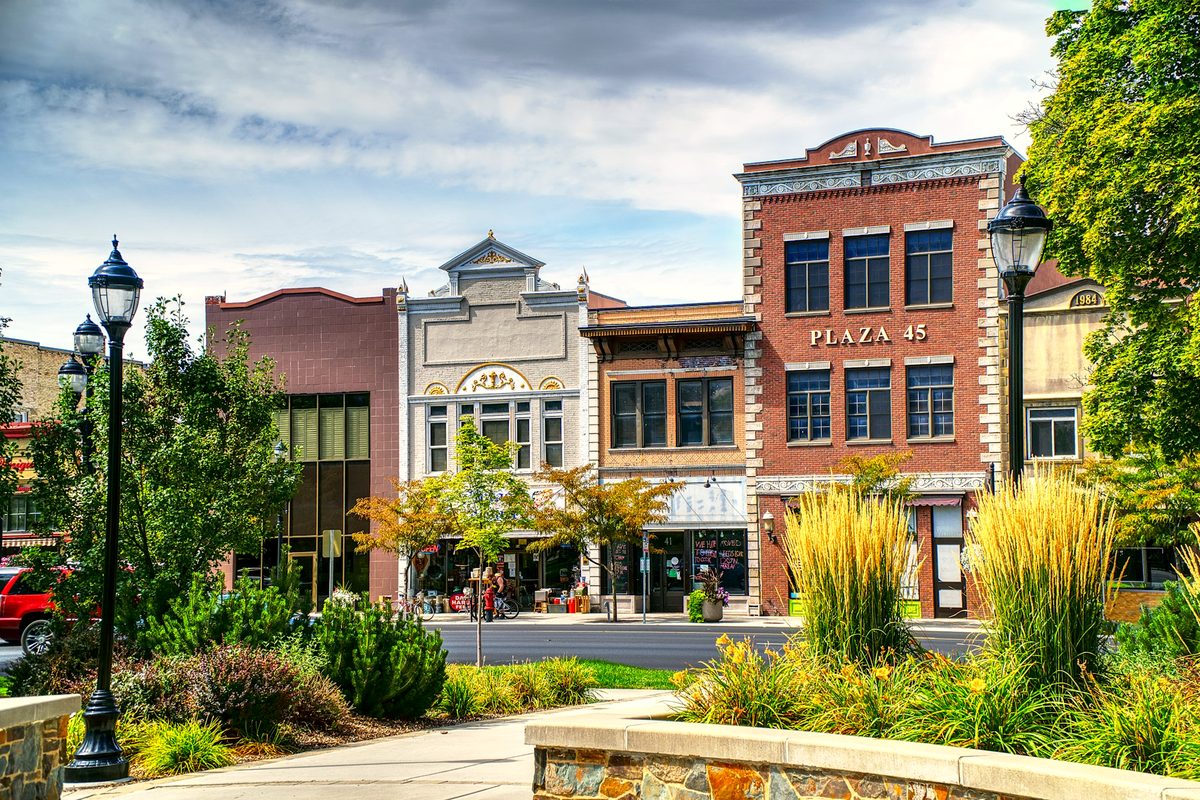 Heritage mixed-use precinct with ground-floor retail and apartments above